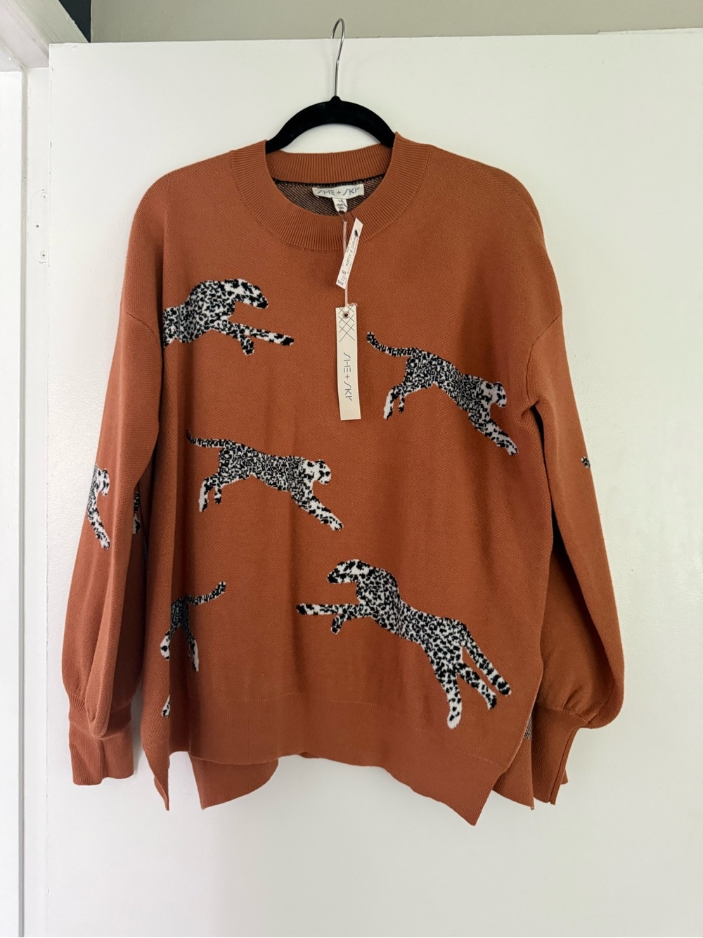 She + Sky Rust Crewneck Sweater with Black-and-White Leopard Motifs